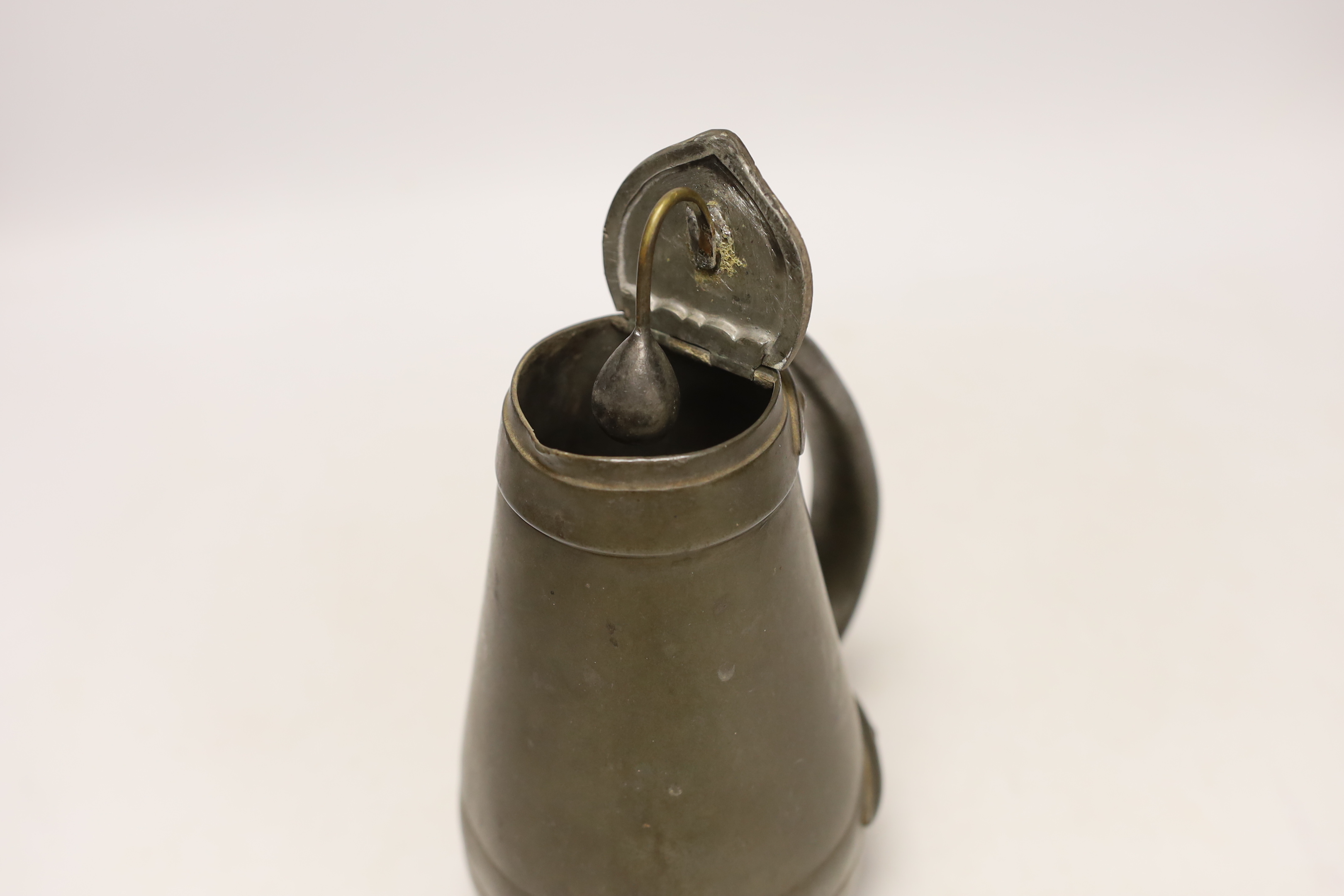 A Liberty Tudric pewter water jug, 17cm high